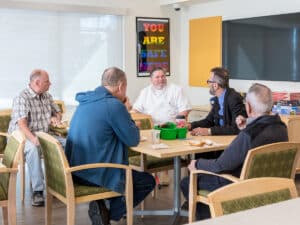 Group of people discussing ideas in a safe space